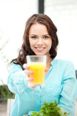 Beautiful woman with glass of juice clipart