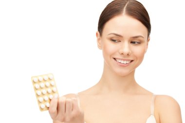 Young beautiful woman with pills clipart