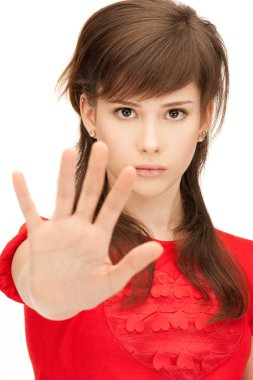 Teenage girl making stop gesture clipart