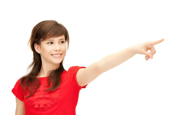 Девочка-подросток показывает пальцем — стоковое фото