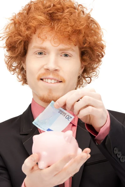 Man with piggy bank and money — Stock Photo, Image