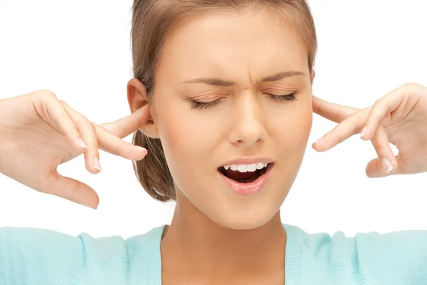 Frau mit Fingern in den Ohren — Stockfoto