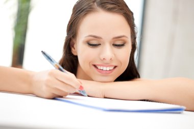 Happy woman with big notepad clipart