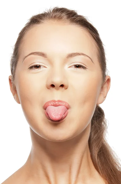 Adolescente menina saindo de sua língua — Fotografia de Stock