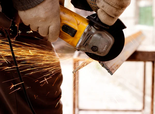 stock image Worker cutting metal with sparks