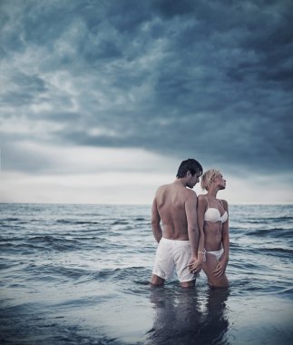 Beautiful couple in the sea clipart