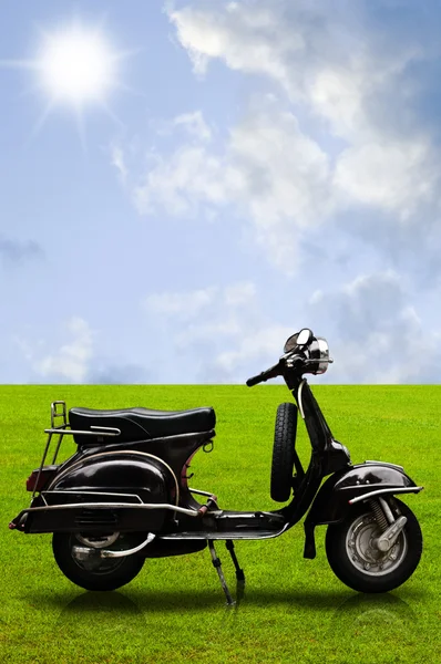Vintage motorbike on the field — Stock Photo, Image