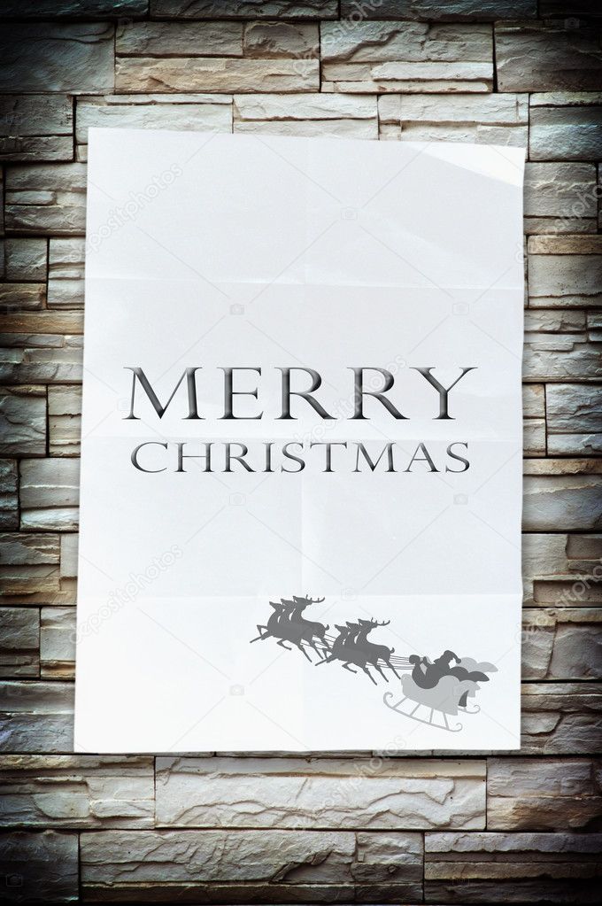 The merry christmas word on the crumpled paper