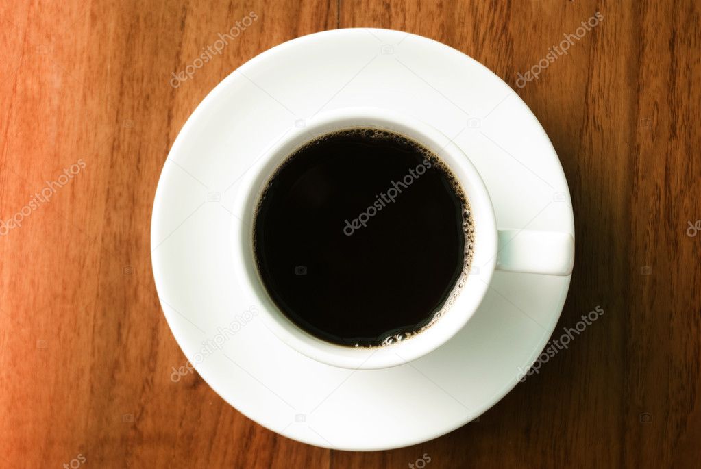 Hot coffee cup on wooden table