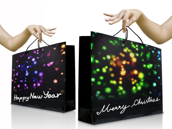 Girl hand pick up the holiday shopping bag — Stock Photo, Image
