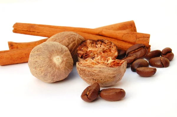 Cinnamon, grains of coffee and nutmeg — Stock Photo, Image
