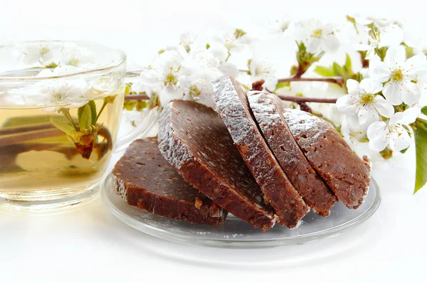 Chocolate dessert, tea and cherry blossoms — Stock Photo, Image