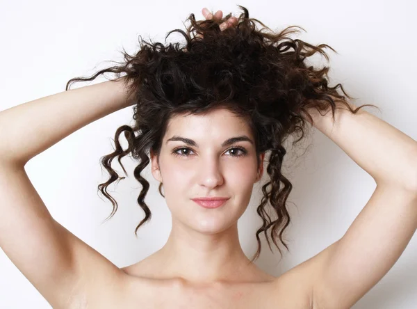 stock image Beautiful yung woman touches her hair