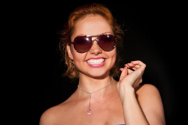Low Key Portrait of a woman in sunglasses — Stock Photo, Image