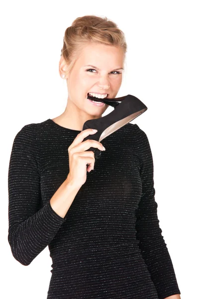Obrázek dívka v černých šatech s botou v ruce — Stock fotografie