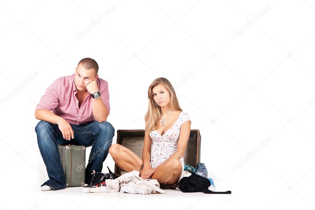 Picture of a man on a suitcase waiting for his girl