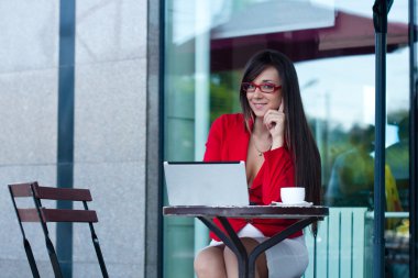 Businesswoman in outdoors cafe