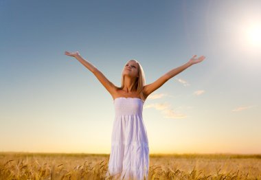 Woman walking on wheat field clipart