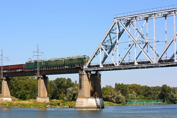 Freight train on the railway bridge — Stockfoto