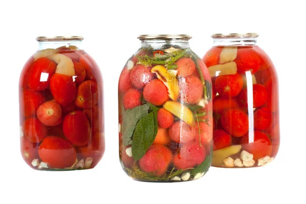 Röda tomater i en glasburk — Stockfoto