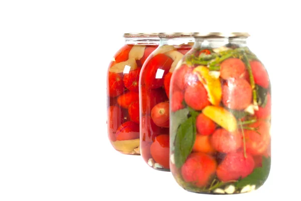 Red tomatoes in a glass jar — Stock Photo, Image