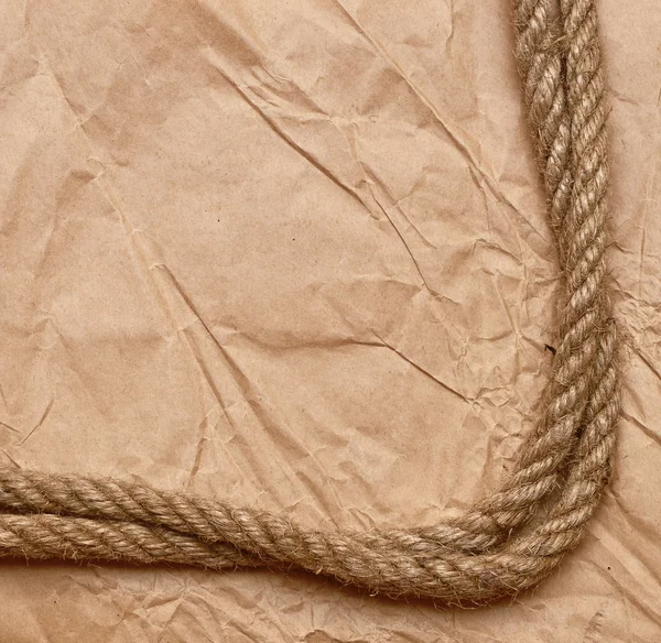 Uma corda velha amarrada em um nó — Fotografia de Stock