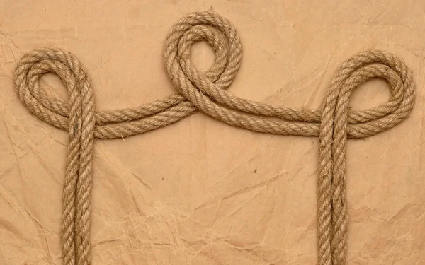 Rope on old paper — Stock Photo, Image