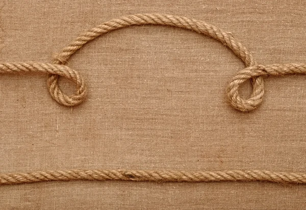 Cuerdas con un lienzo de arpillera — Foto de Stock