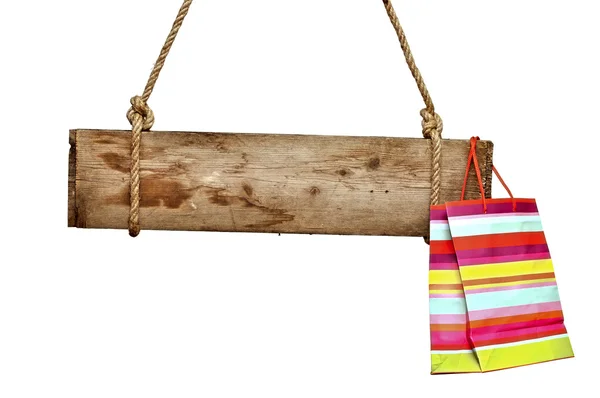 Trä skylt med shopping väska på vit — Stockfoto