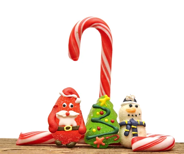 Cukierki laski i zabawki świąteczne nad białym — Zdjęcie stockowe