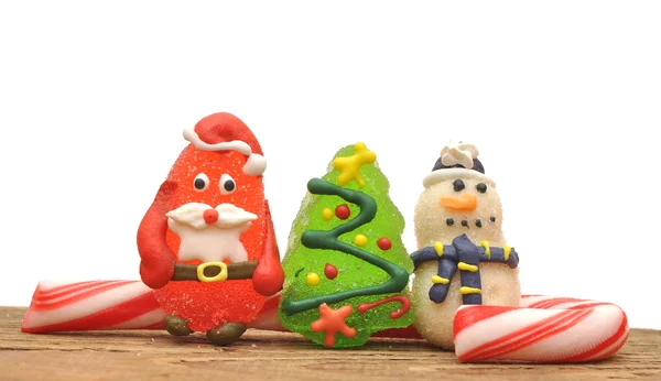 Bastoncini di zucchero e giocattoli di Natale su bianco — Foto Stock