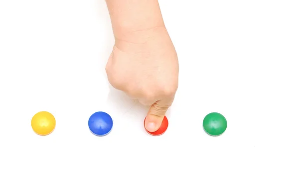 Детская рука нажимает на красную кнопку — стоковое фото