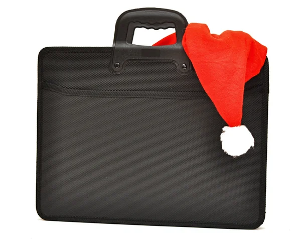 Black business briefcase with Santa's hat — Stock Photo, Image