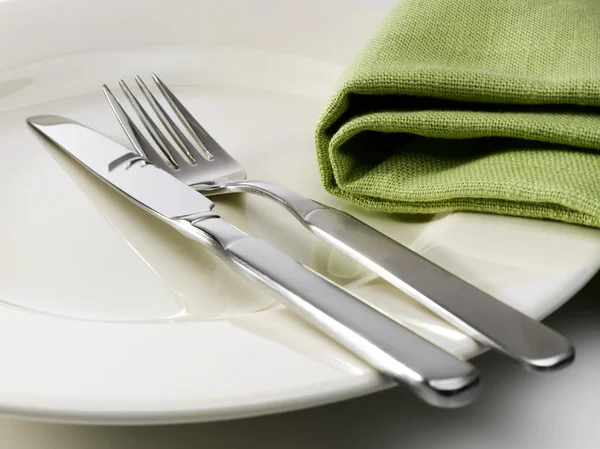 Cutlery on a plate — Stock Photo, Image