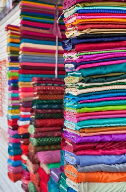 Colorful fabrics in the store clipart