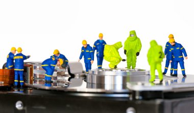 Team of technicians repair hard disk clipart