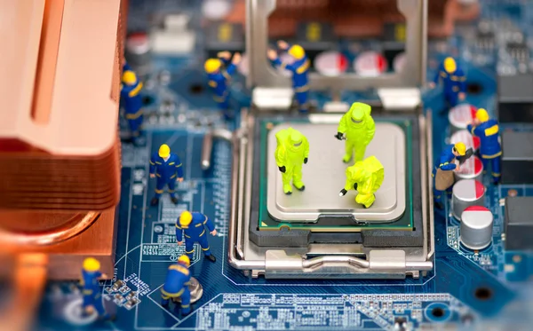 stock image Group of technicians repair computer