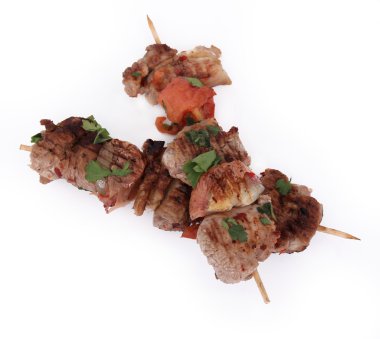 Tasty lamb skewers isolated on white