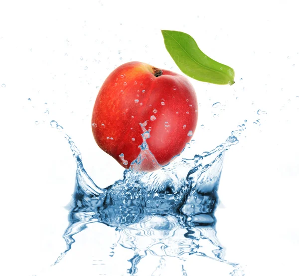 Nectarine dropped into water splash on white — Stock Photo, Image
