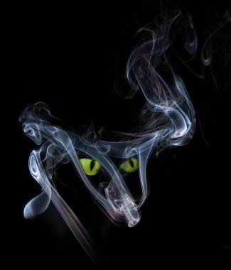 Green cat eyes in a smoke clipart