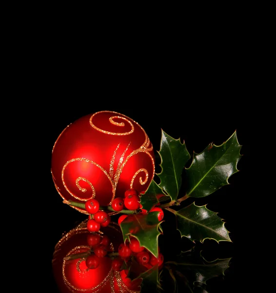 Christmas red ball with holly branch — Stock Photo, Image