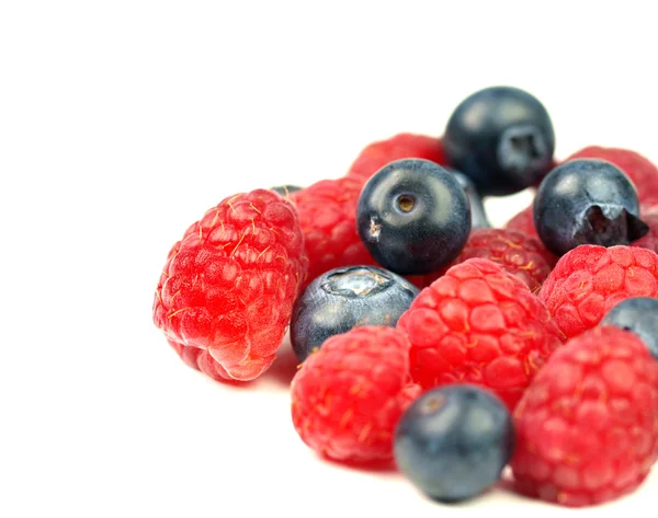 Fresh raspberries and blueberries on white background — Stock Photo, Image