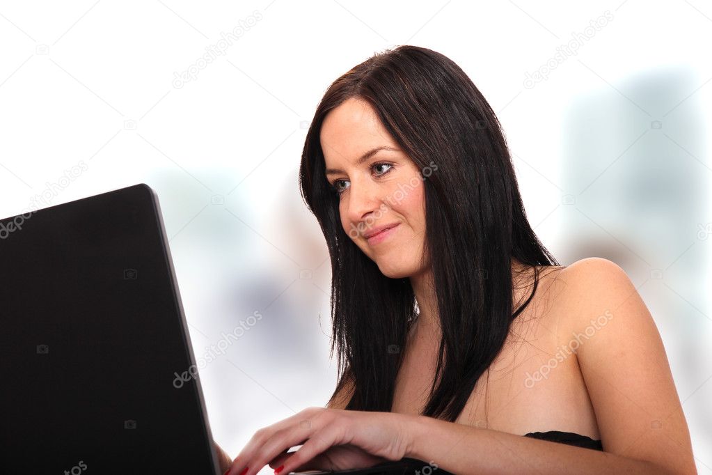 Attractive brunette woman with notebook