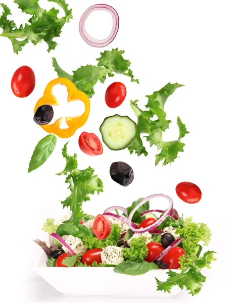 Fresh vegetable in motion over white — Stock Photo, Image