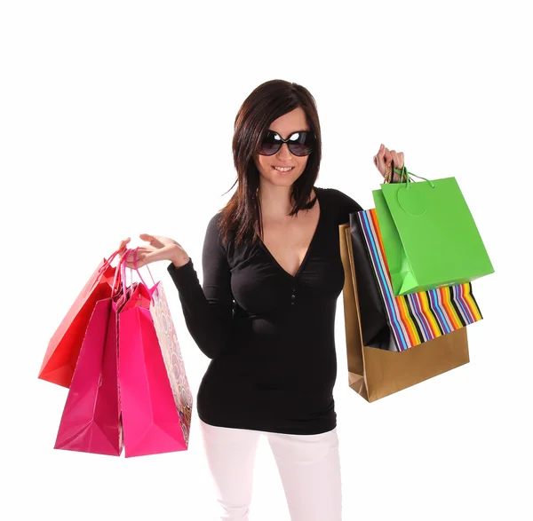 Mooie vrouw met een heleboel shopping tassen — Stockfoto
