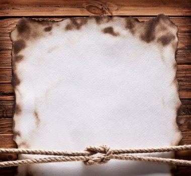 Image of old paper on wood background. clipart