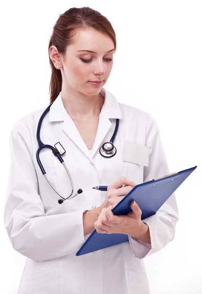 Doctor completing on medical card. Isolated on a white backgroun — Stock Photo, Image