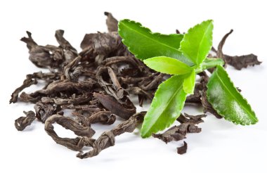 Heap of dry tea with green tea leaves. clipart