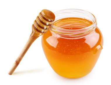 Honey in a glass jar with a stick clipart