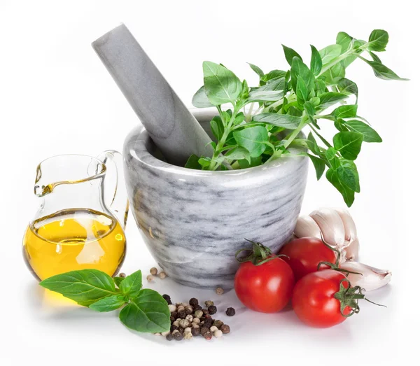Mortar with pestle and basil herbs and olive oil. — Stock Photo, Image